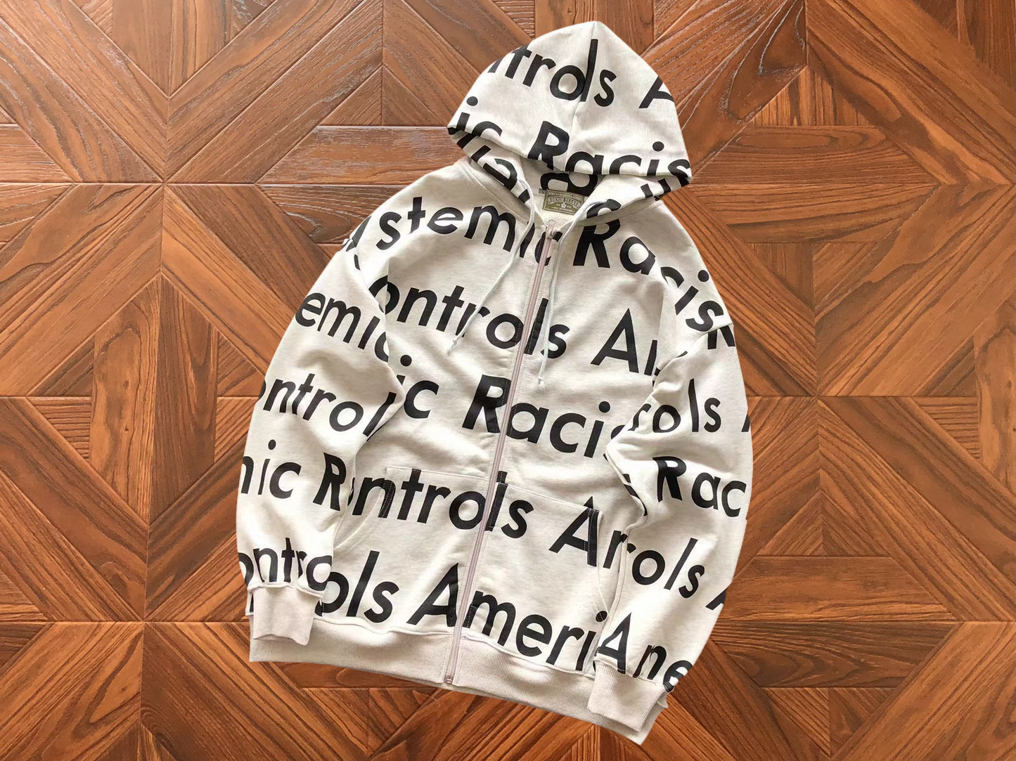 DENIM TEARS X ARTHUR JAFA SYSTEMIC RACISM HOODIE