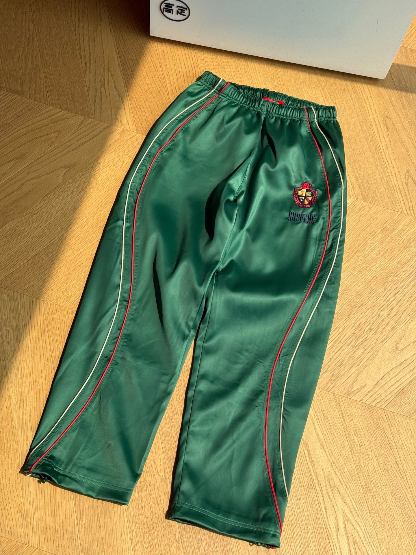 SUPREME TRACK PANTS