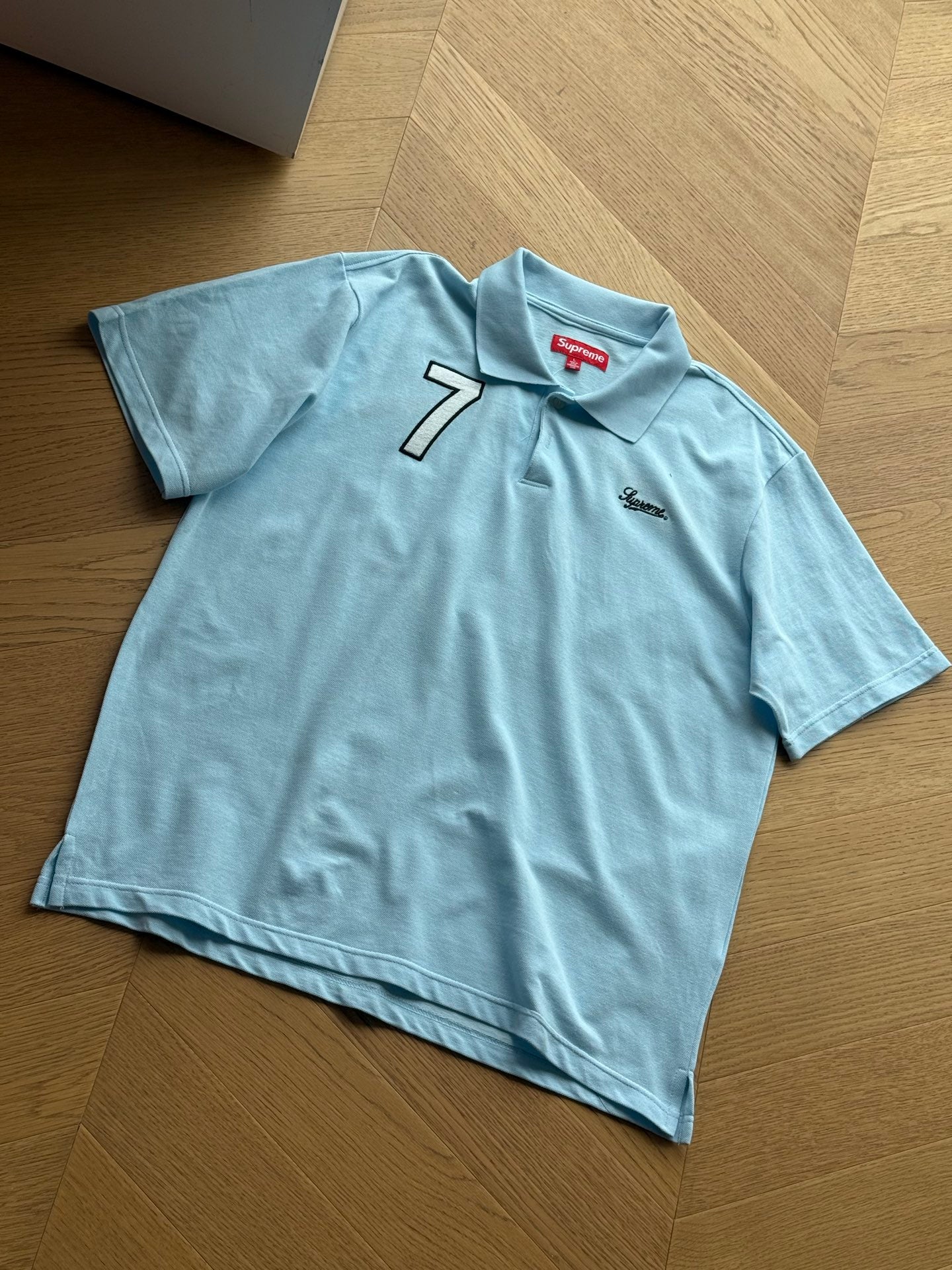 SUPREME WORLD FAMOUS POLO SHIRT