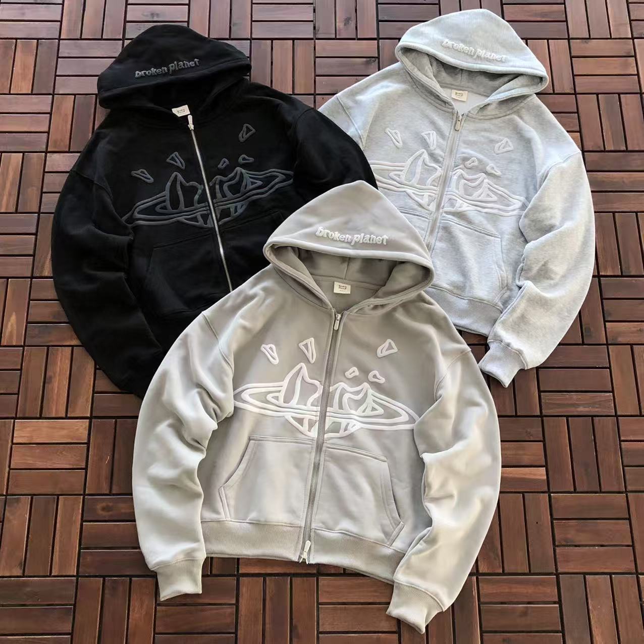 BROKEN PLANETS ZIPPED HOODIE