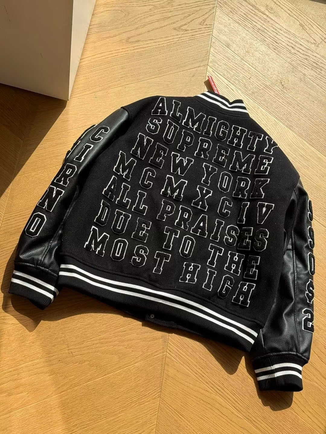 SUPREME PRAISES VARSITY JACKET