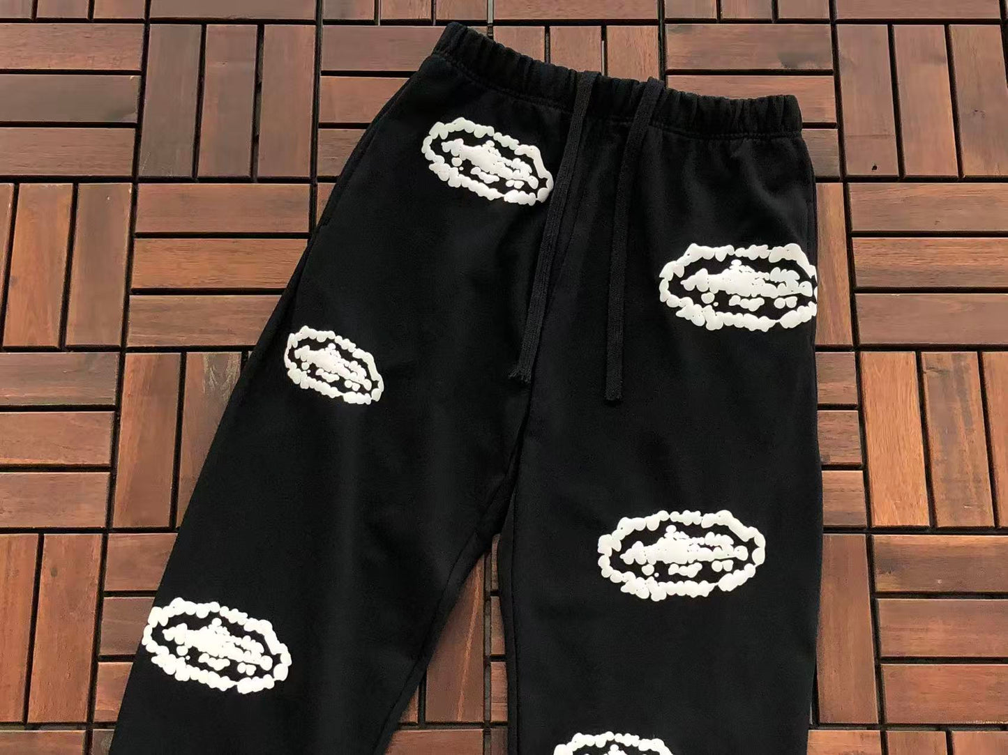 DENIM TEARS X CORTEIZ WREATH PRINT PANTS