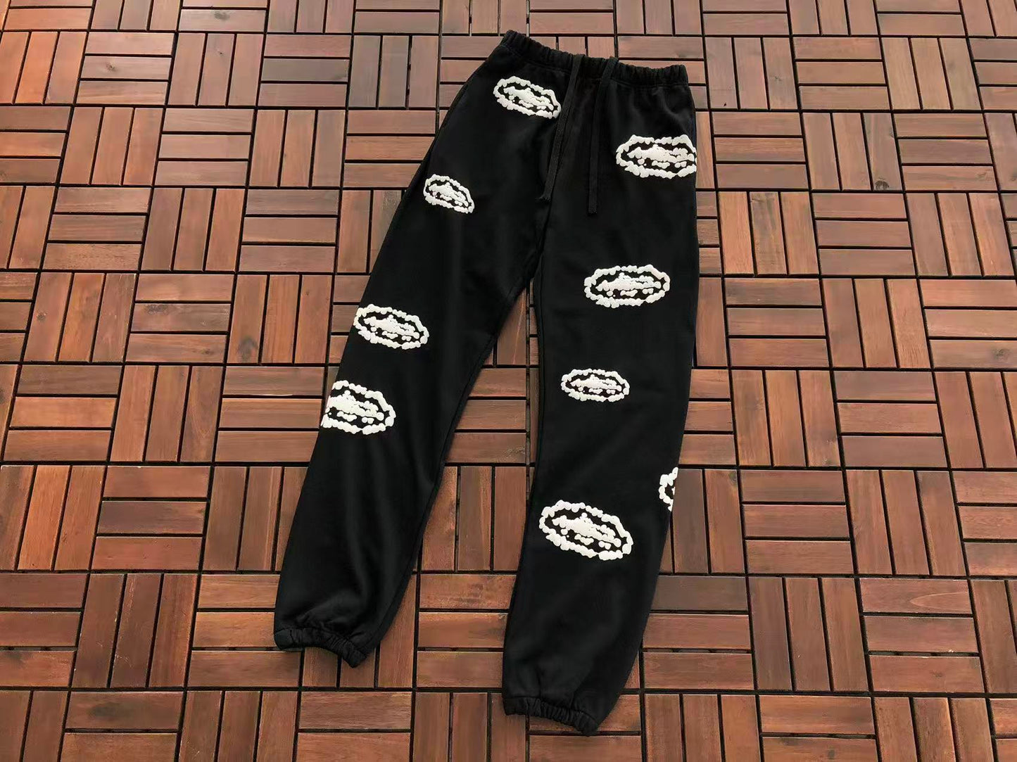 DENIM TEARS X CORTEIZ WREATH PRINT PANTS