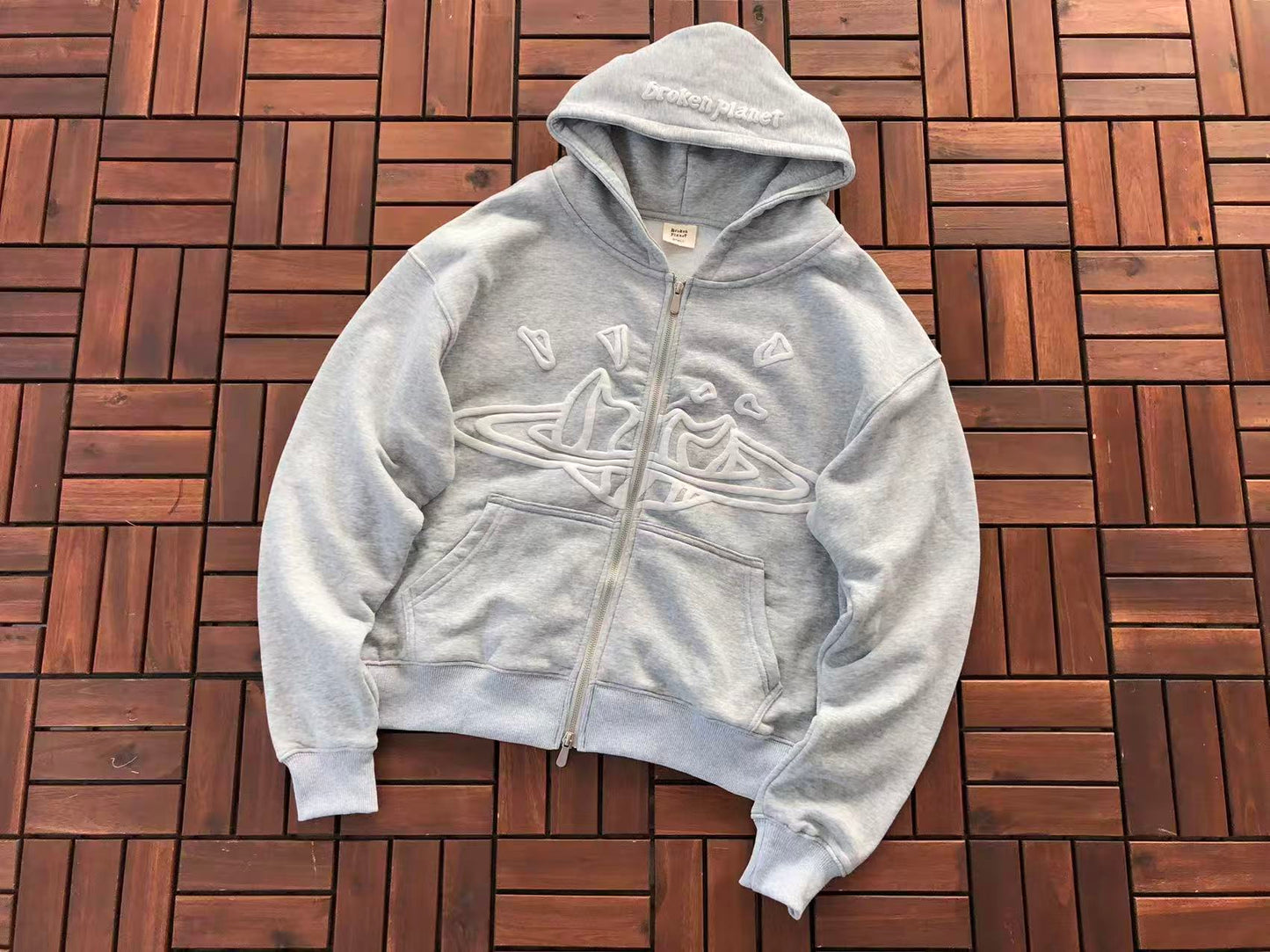 BROKEN PLANETS ZIPPED HOODIE