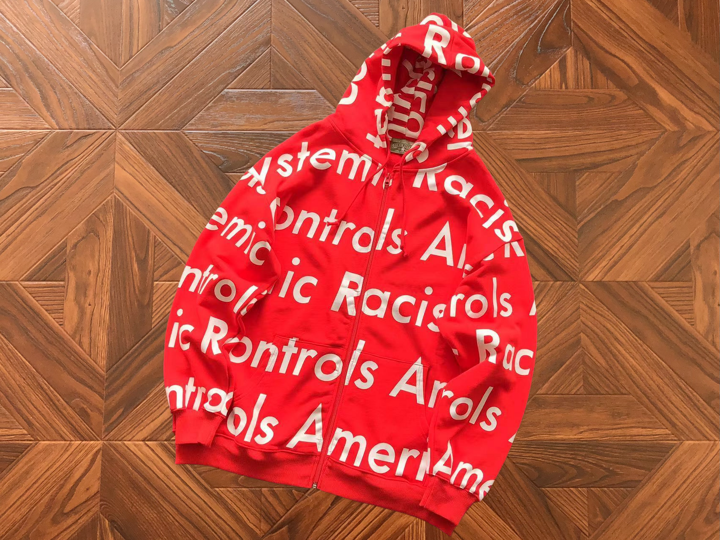 DENIM TEARS X ARTHUR JAFA SYSTEMIC RACISM HOODIE