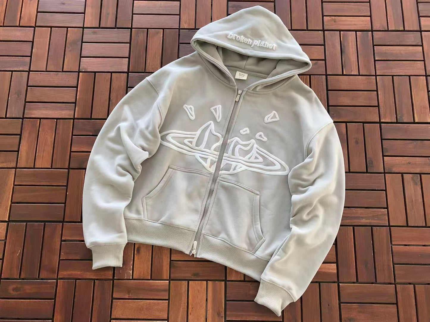 BROKEN PLANETS ZIPPED HOODIE
