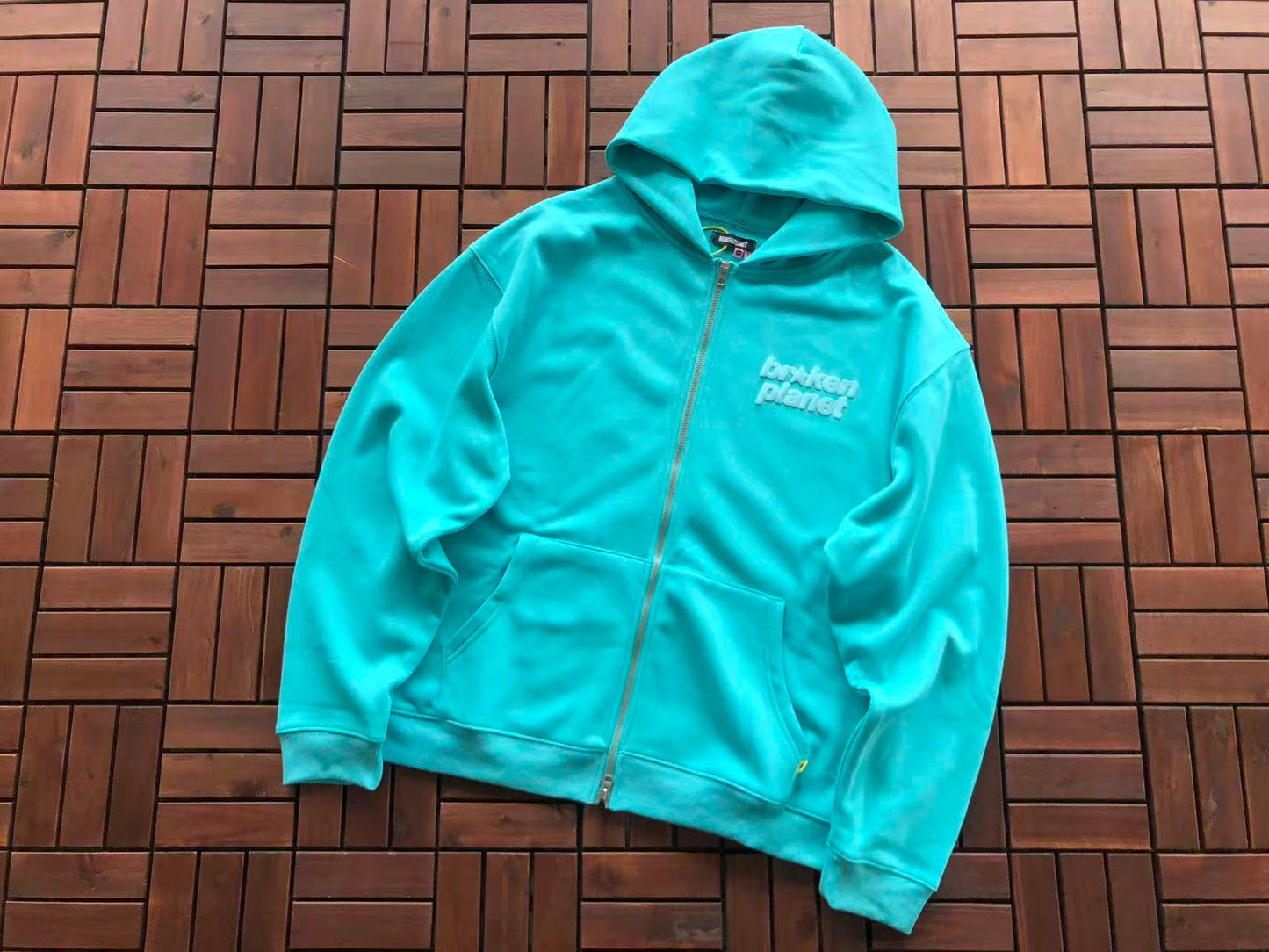 BROKEN PLANETS SPRAY DYED ZIPPED HOODIE