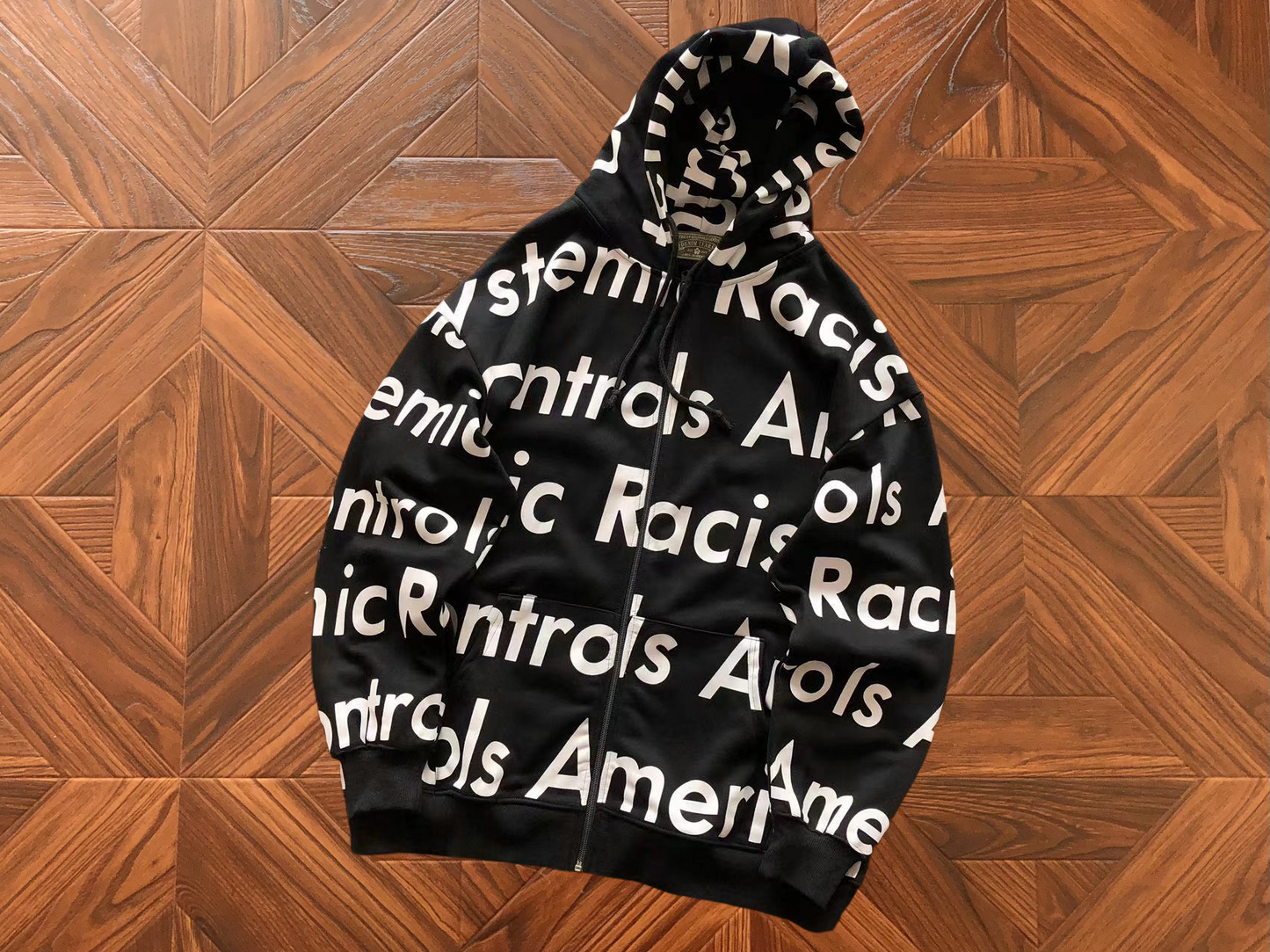 DENIM TEARS X ARTHUR JAFA SYSTEMIC RACISM HOODIE
