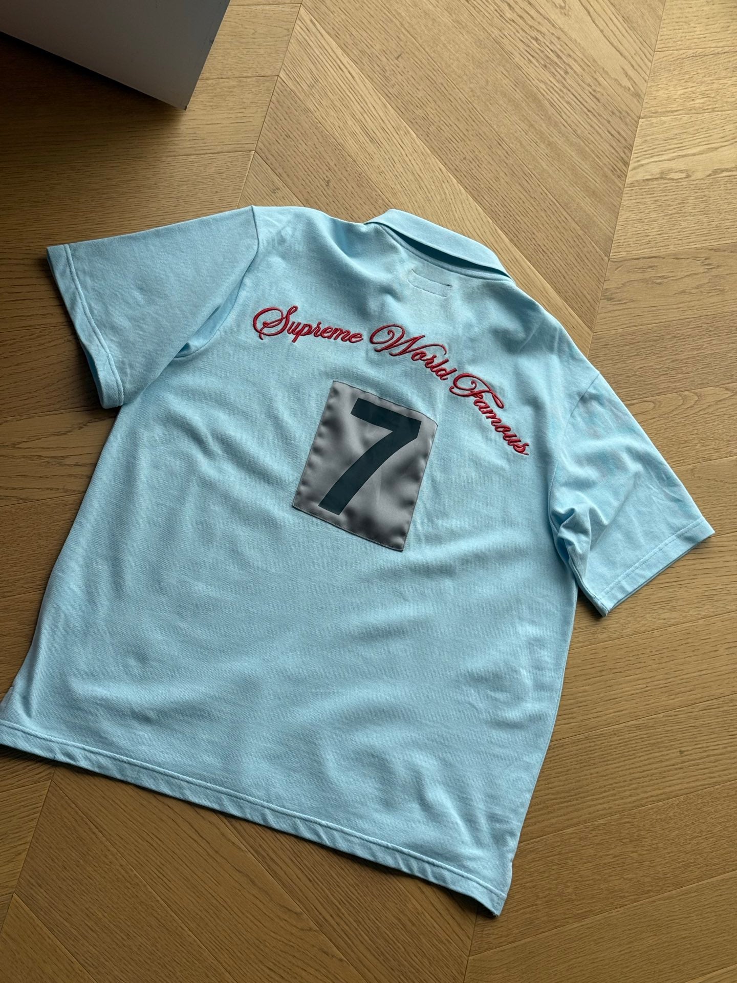 SUPREME WORLD FAMOUS POLO SHIRT