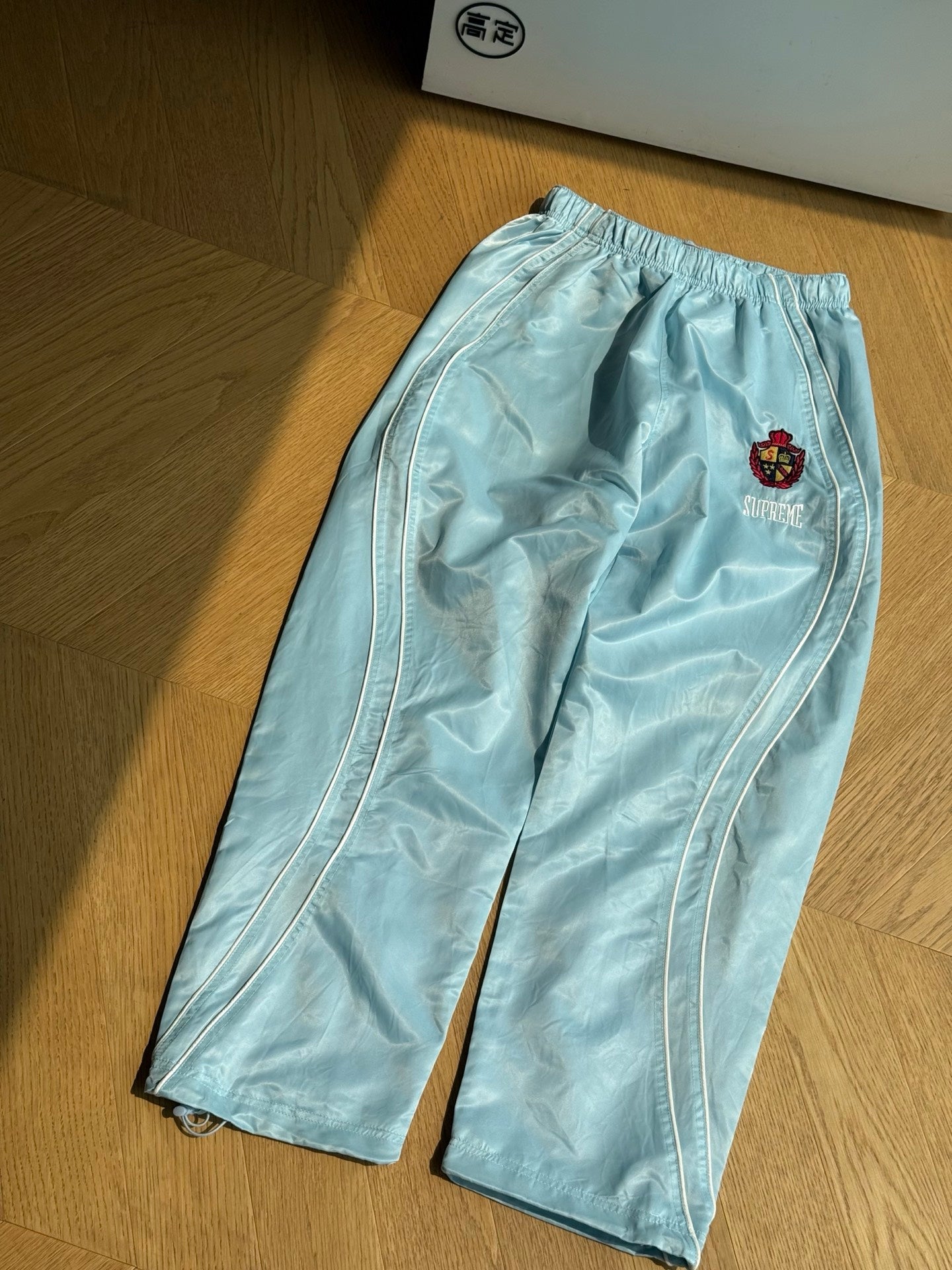 SUPREME TRACK PANTS