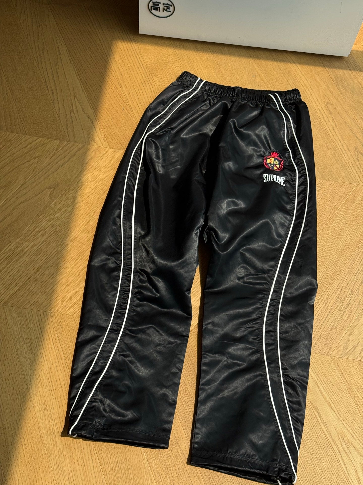 SUPREME TRACK PANTS