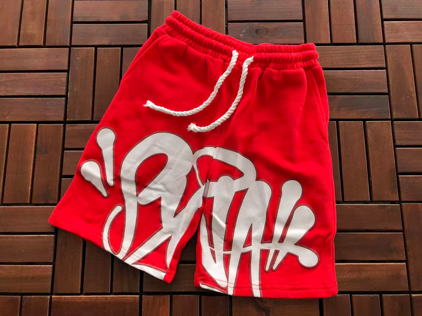 SYNA WORLD LOGO SHORTS